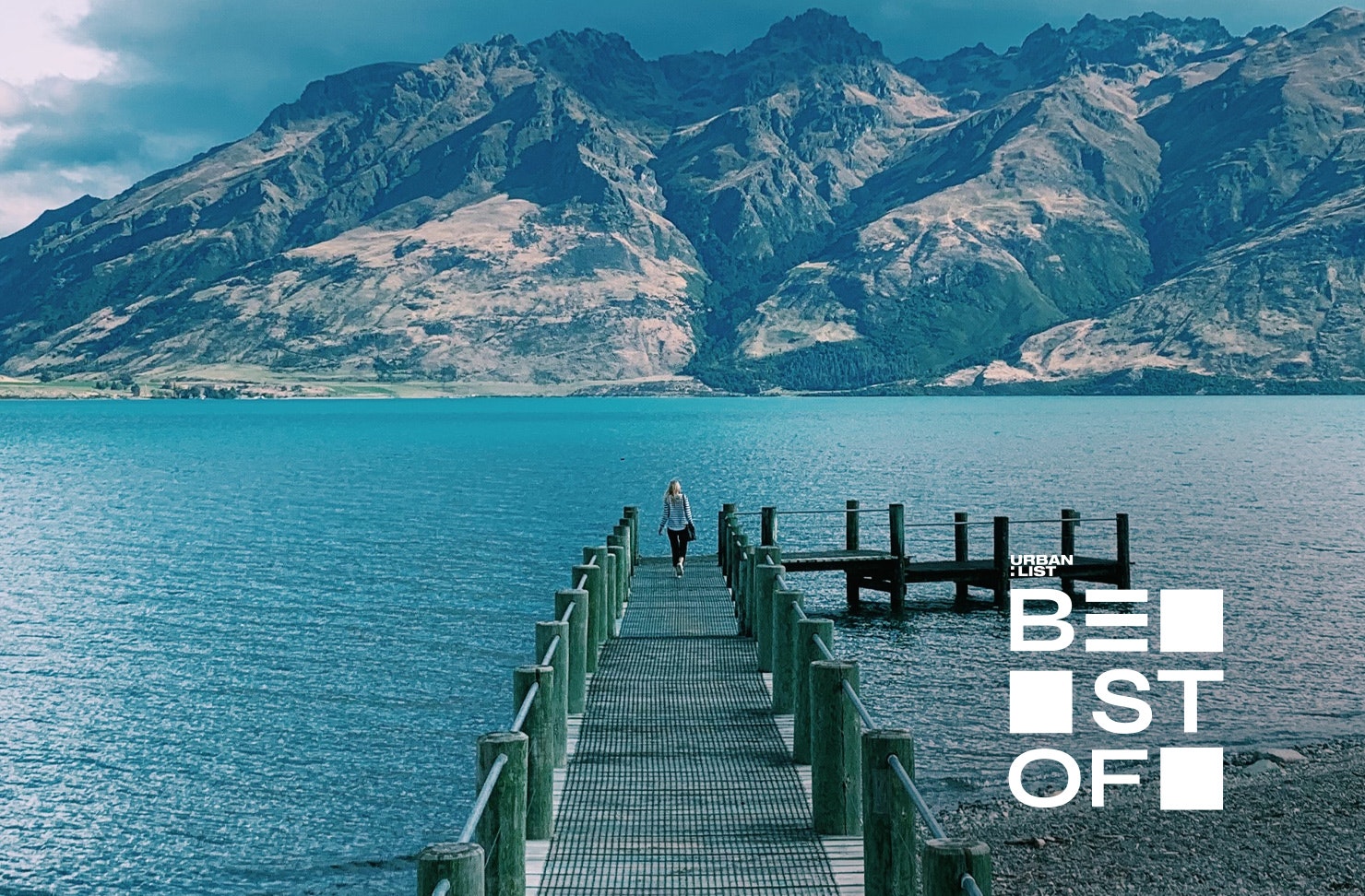 Someone walks along the pier in Queenstown.
