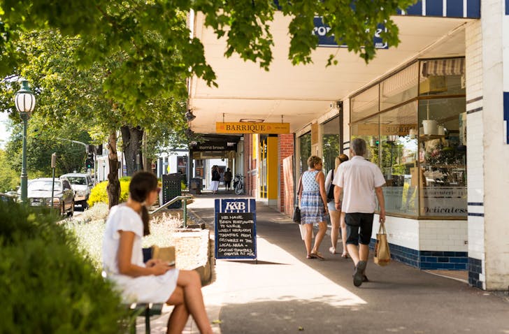 Healesville store Kitchen & Butcher with people walking past in the main street of Healesville, Victoria.