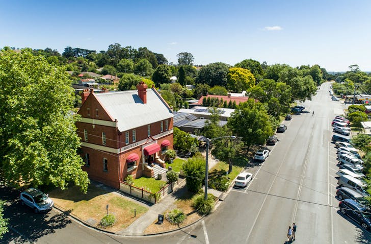 An aerial shot of Loch Distillery & Brewery along with the main street of Loch village in Victoria.