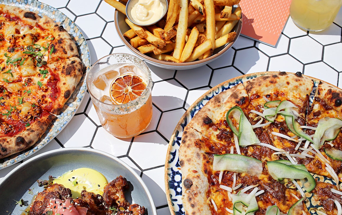 a table full of share food at one of the best restaurants for large groups in Perth