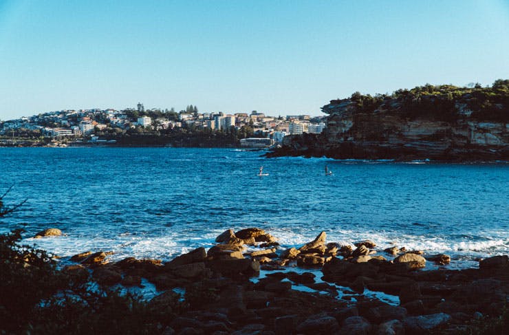 Stand up paddle boarders at Gordons Bay in Sydney. 