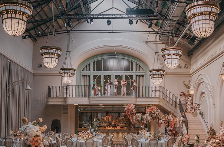 The opulent staircase and ballroom at The Eveleigh wedding venue in Sydney. 