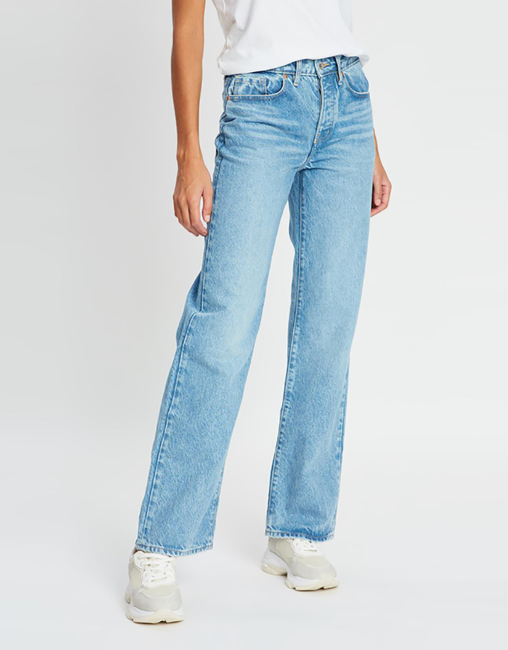 Some of the best wide leg jeans available for 2021, coloured light blue and sitting loosely on a model..
