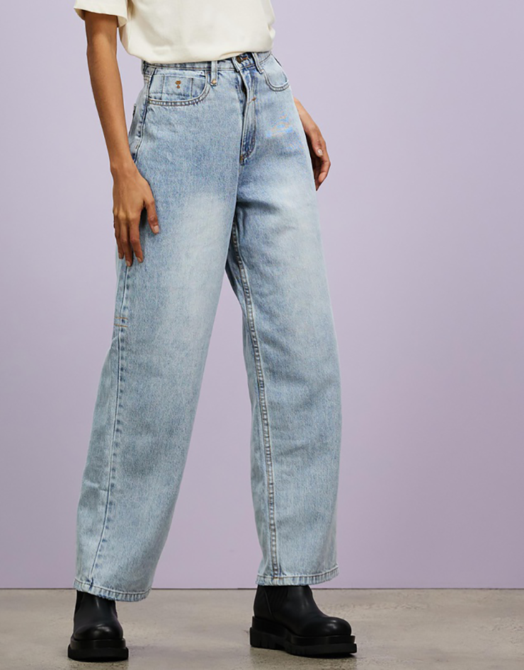 Some of the best wide leg jeans available for 2021, coloured blue grey and sitting loosely on a model..