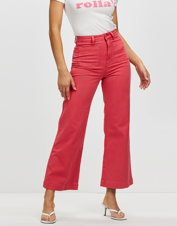 Some of the best wide leg jeans available for 2021, coloured light red.