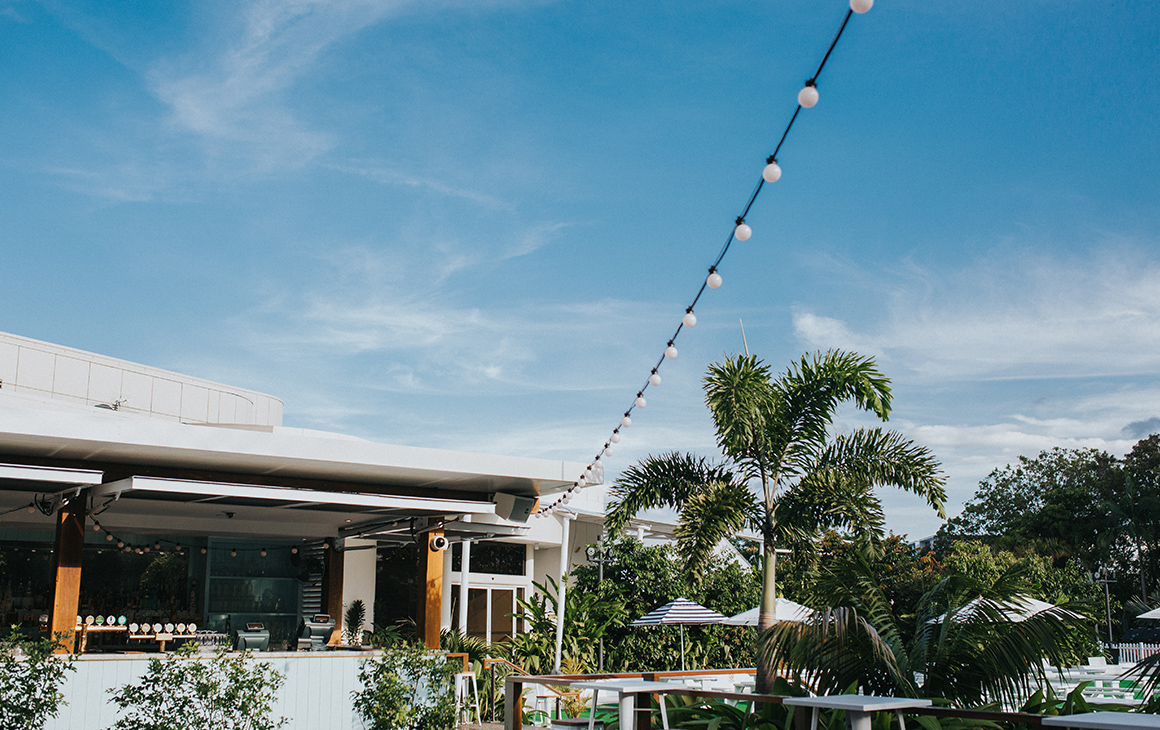 a garden bar with fairy lights