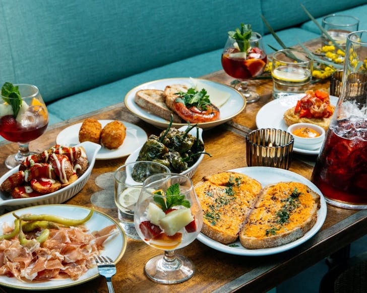 a huge bottomless brunch spread including jamon and cheese at bar lucia