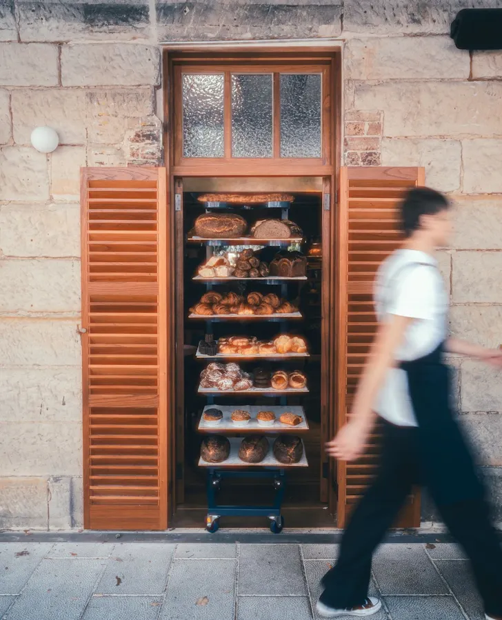 a shelf of pastries set in the sandstone cottage at ap bread and wine cafe in darlinghurst