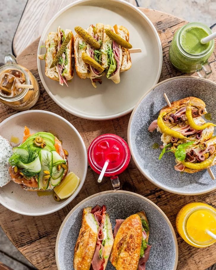 breakfast sandwiches, bagels, coffee and juices at bondi cafe porch and parlour