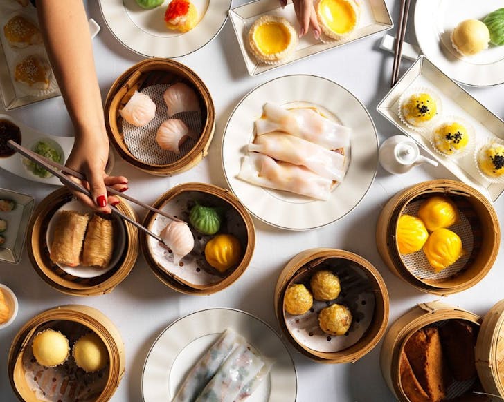 a huge spread of bamboo baskets filled with dumplings from golden century