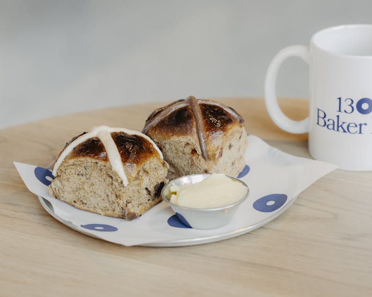 two hot cross buns with a coffee from baker bleu