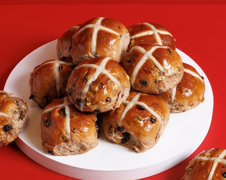 a pile of classic hot cross buns from sydney bakery humble