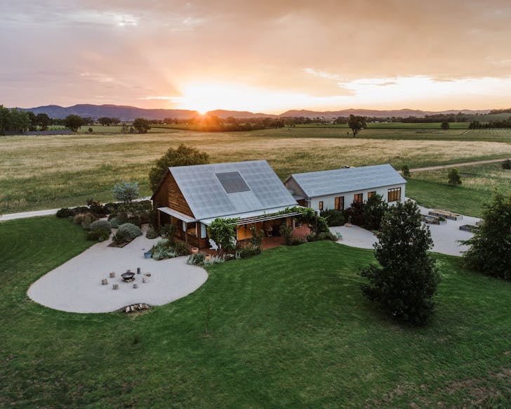 a large house on farmland in mudgee at sunset