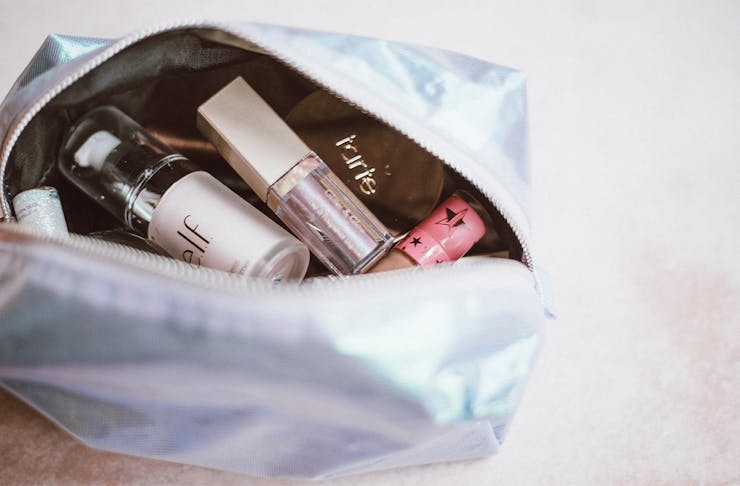 a make up bag filled with products