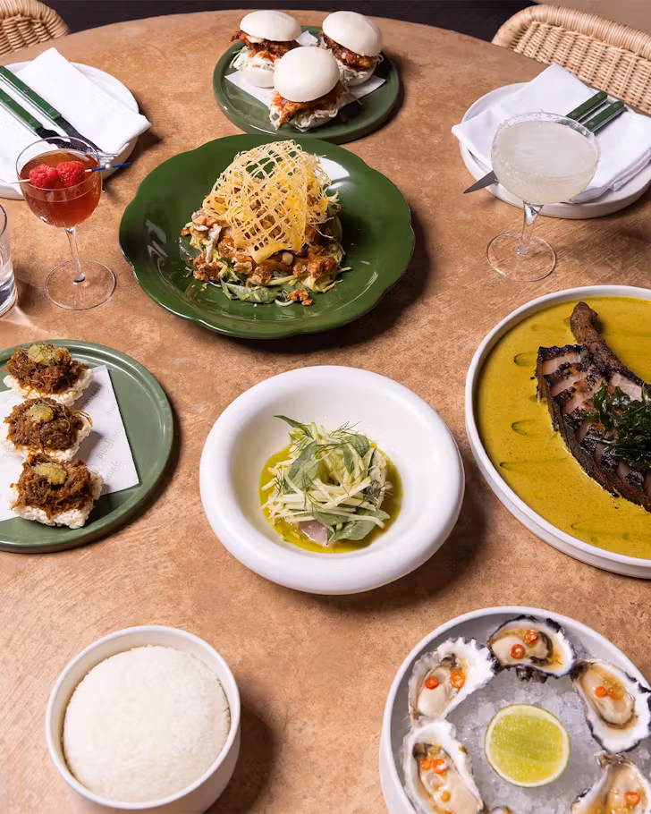 plates of thai food on a table at brisbane restaurant same same