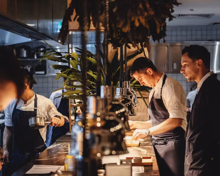 Josh Niland overlooking the kitchen at Sydney restaurant Saint Peter