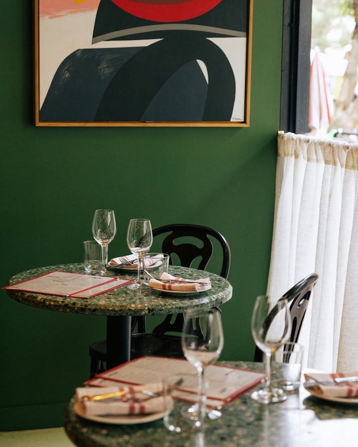 the interior of surry hills restaurant bastardo with a colourful artwork