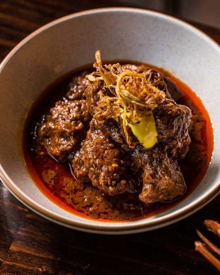 a plate of spicy-looking curry at surry hills indian restaurant foreign return 