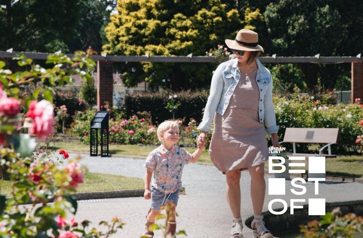 mother and child walk hand in hand through wellington botanic gardens