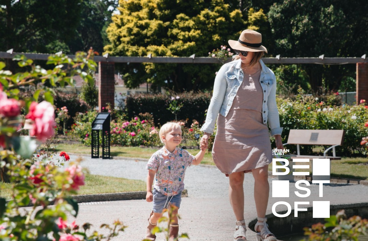 mother and child walk hand in hand through wellington botanic gardens