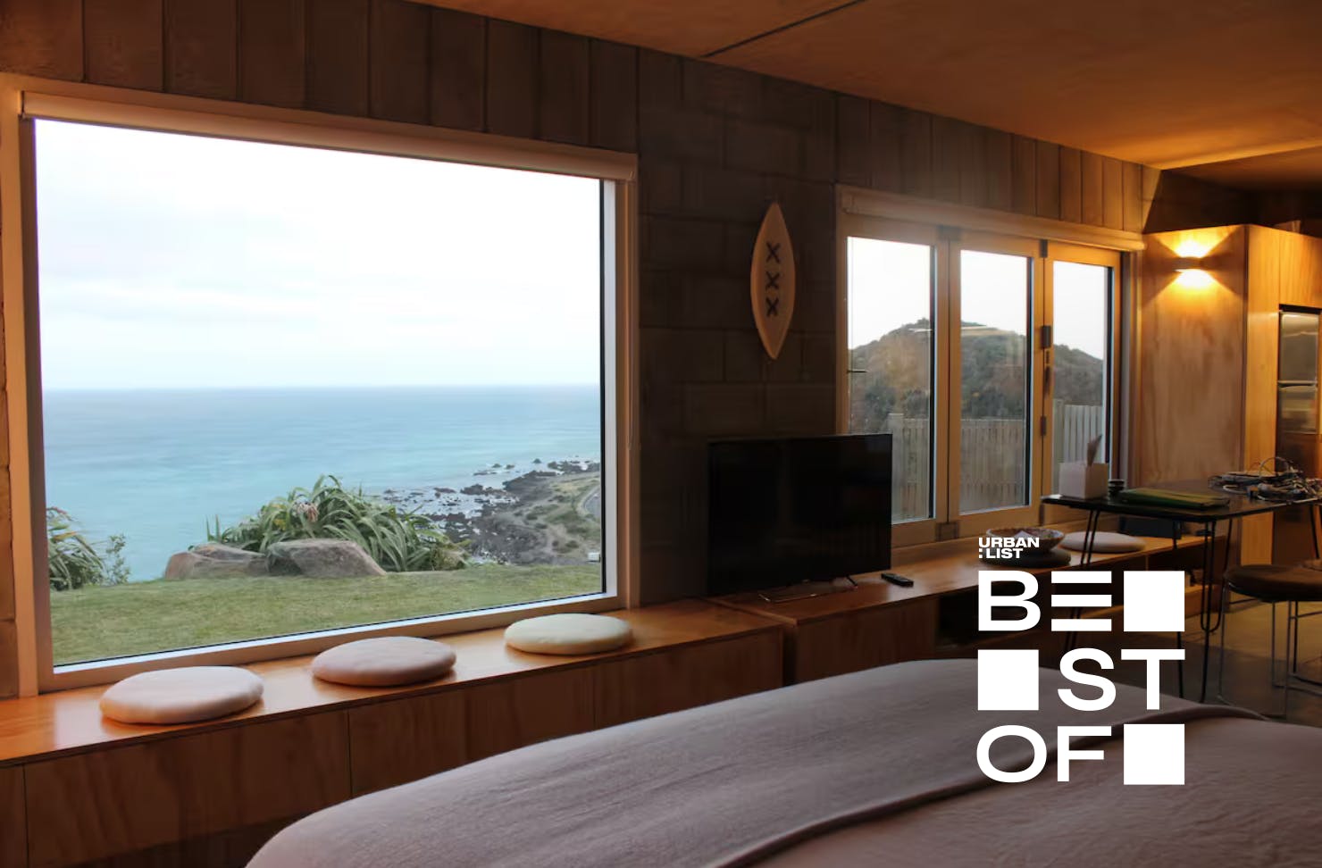 Sea views from the window of a cliff-side Wellington airbnb.