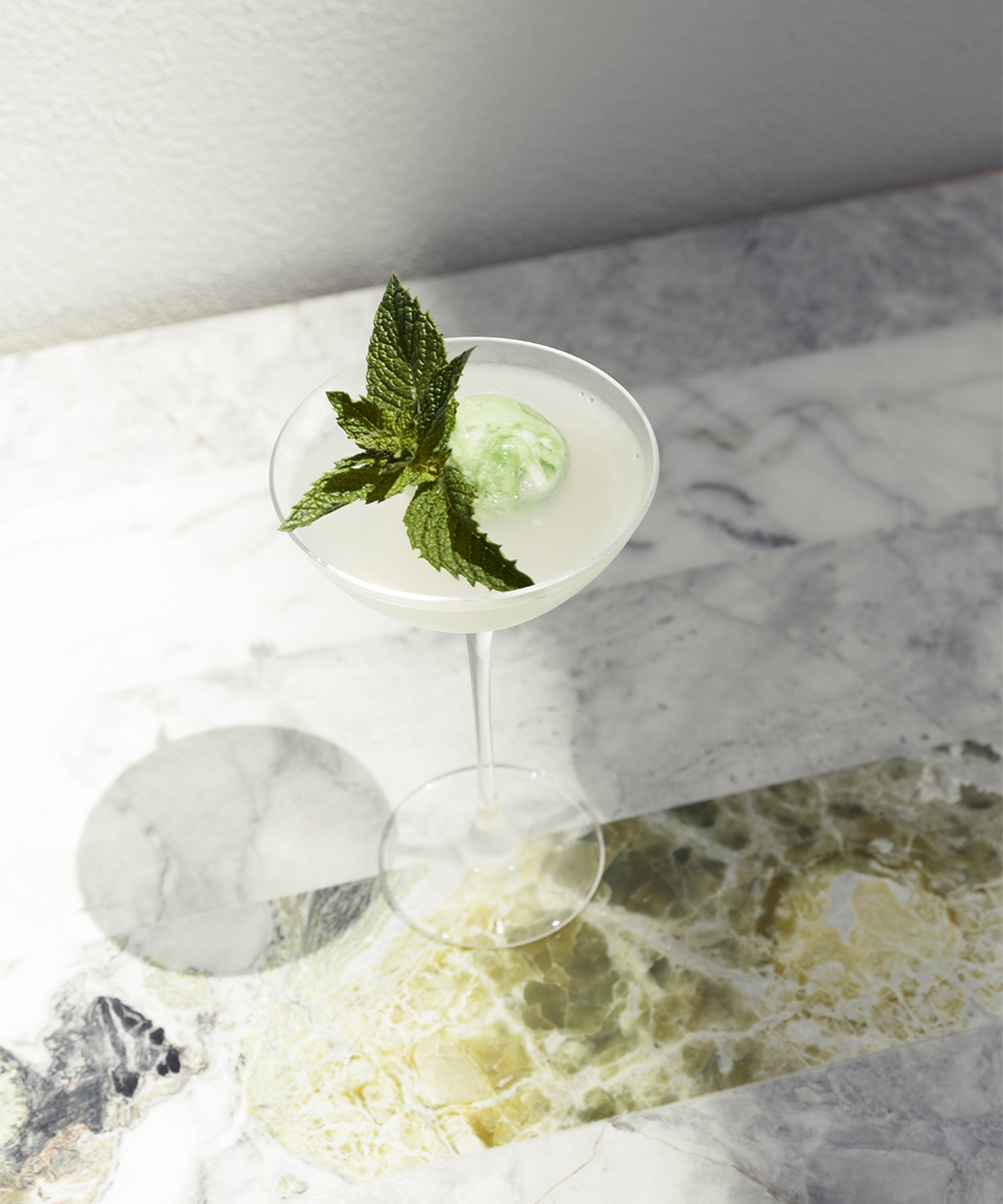 a cocktail on a marble table