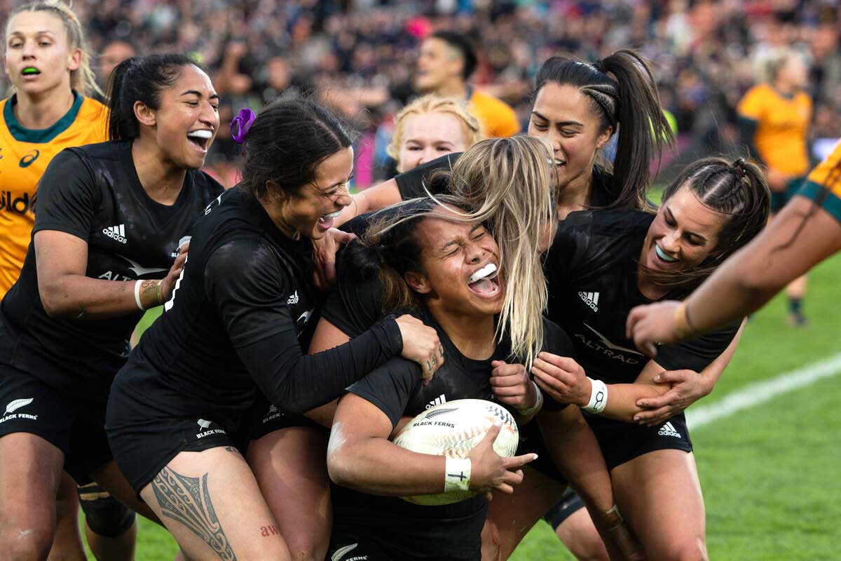Our girls in black celebrating after a try