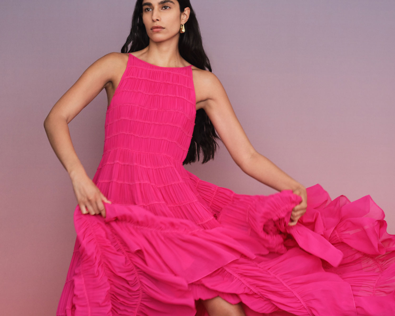 A model in a hot pink Aje dress, which is on sale for Black Friay