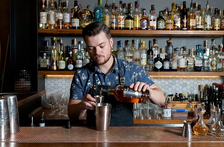 A master bartender making a bespoke cocktail at one of the best bars in Melbourne, The Black Pearl.