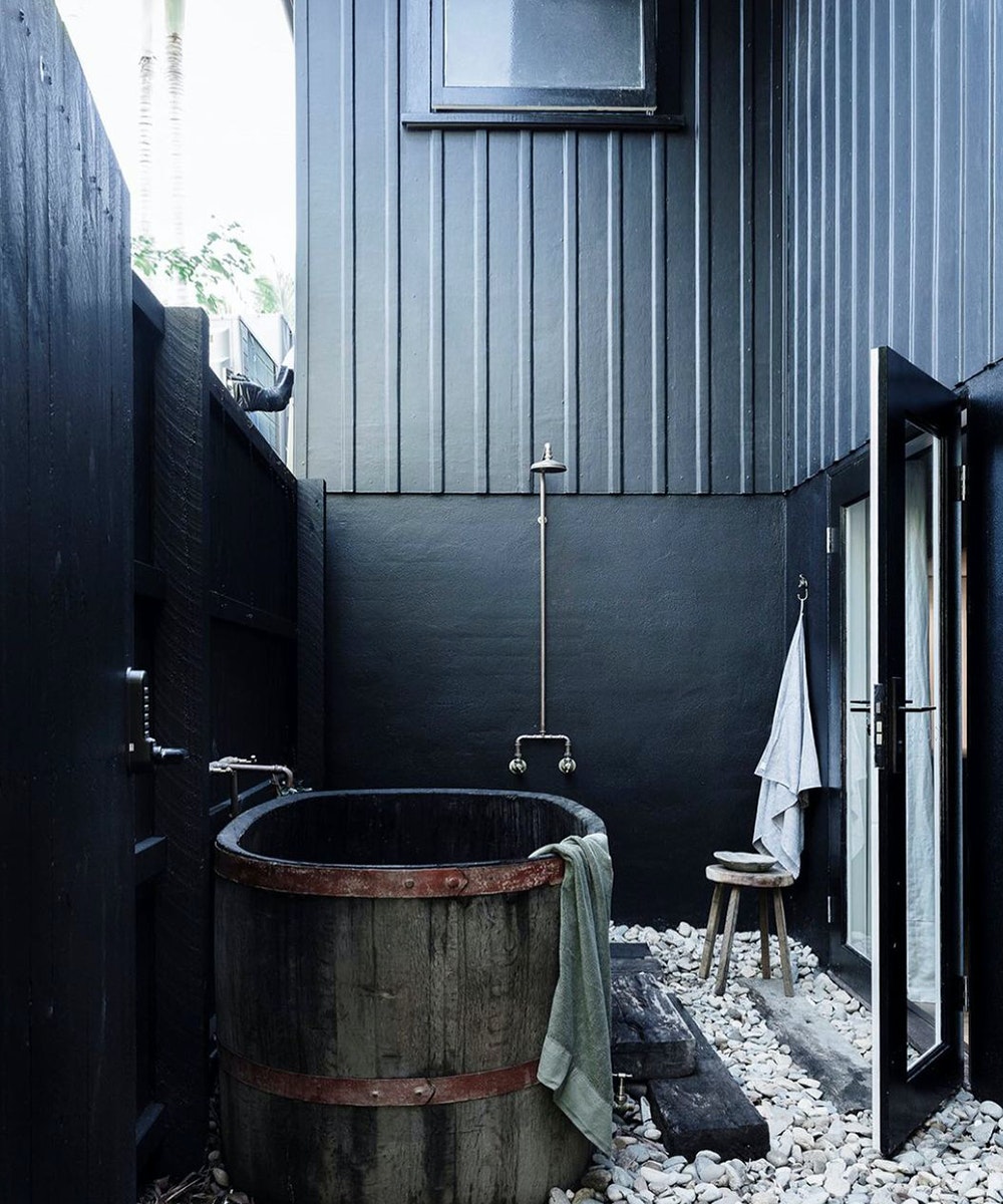 a black outdoor bathtub