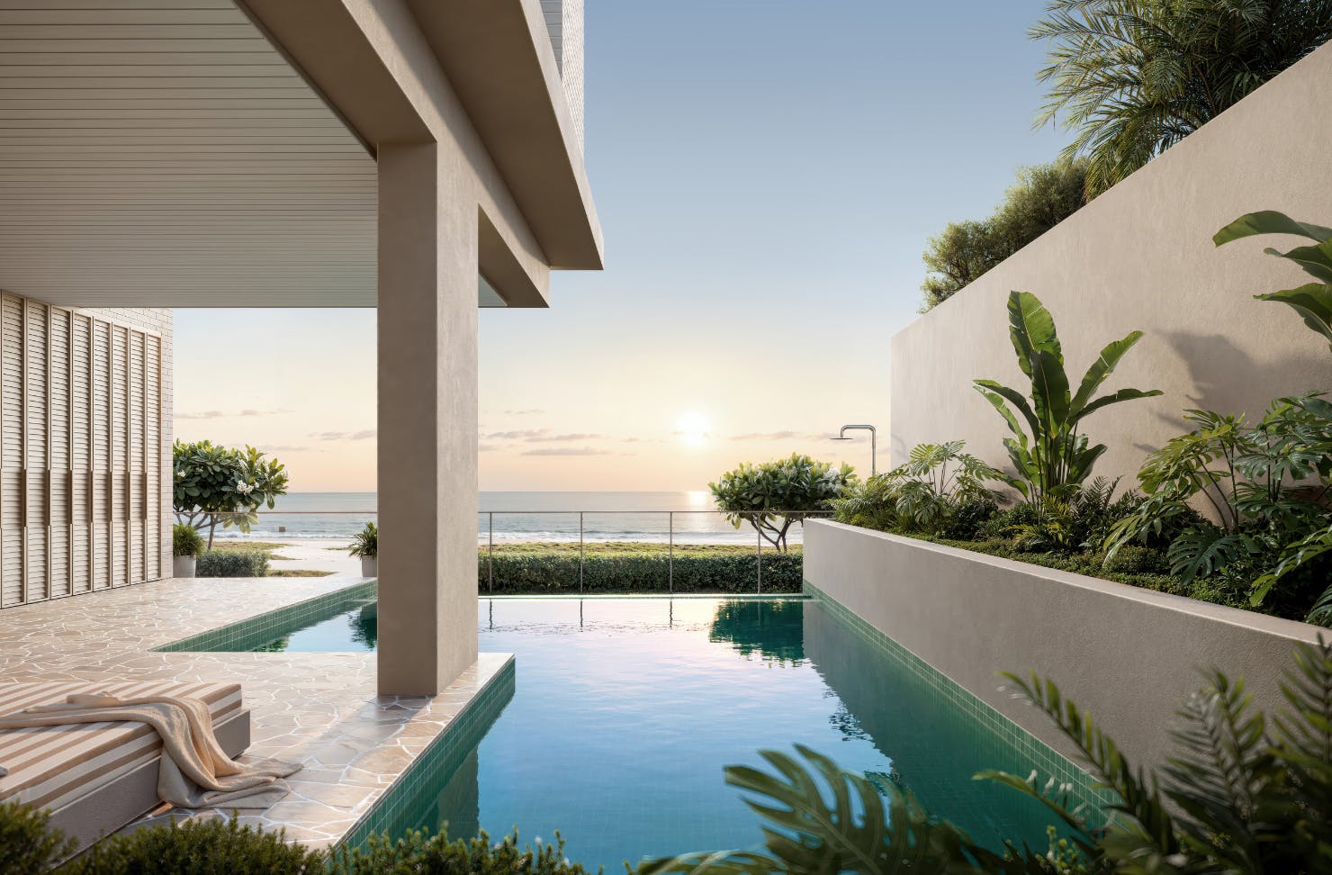 Luxury beachfront pool with tropical landscaping and ocean views at sunset, featuring modern architecture and serene outdoor design.