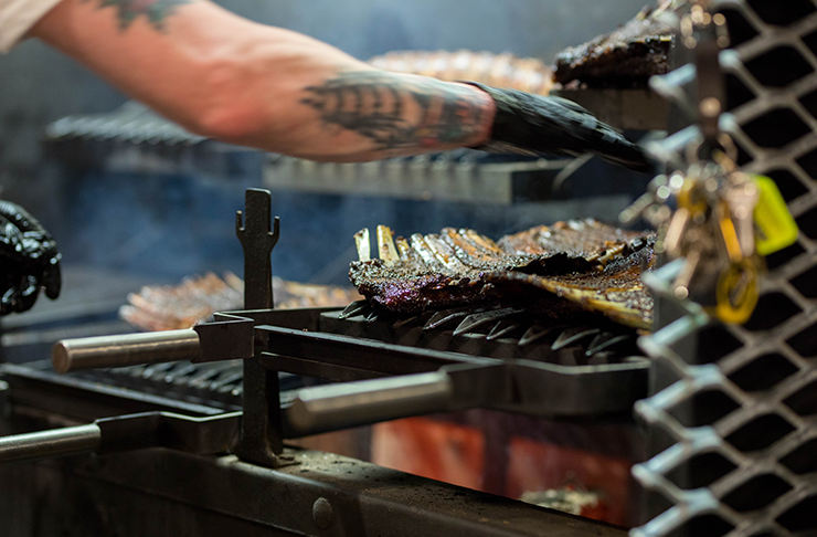 Meat smoking in a giant smoker.