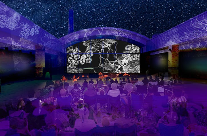 Artistic projections on a courtyard at night. 