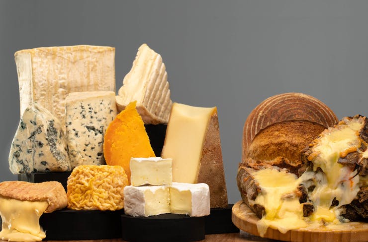 Various French cheeses on display