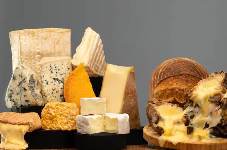 Various French cheeses on display