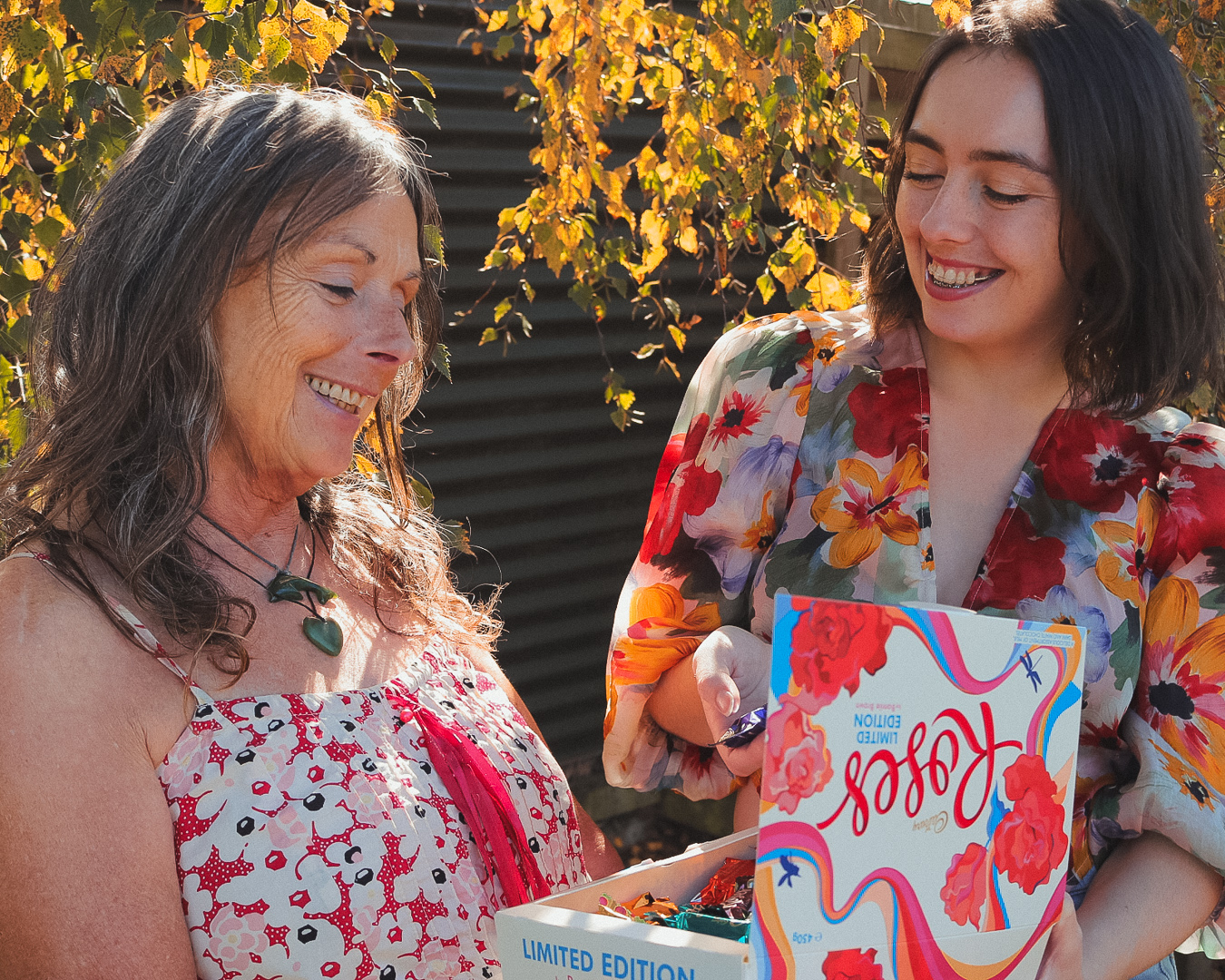 Bonnie Brown on the right showing her mother the new Cadbury Roses box.