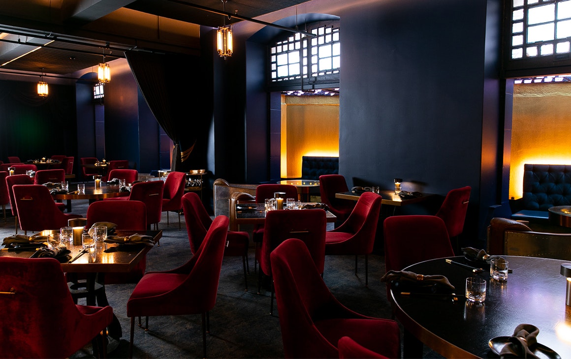dim, moody interior of boom boom room izakaya's dining area