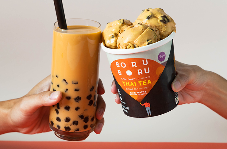 Two hands holding bubble tea and bubble tea ice cream.