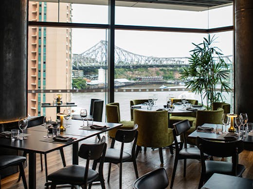 tables with a view of story bridge