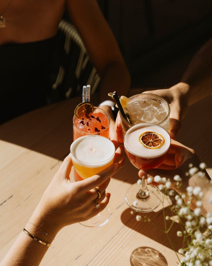 âFriends clinking colourful cocktails at Good Company Bar Perth during bottomless brunch.â