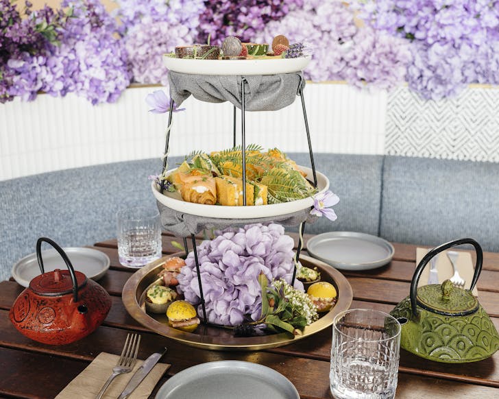 A high tea tower with tea pot cocktails