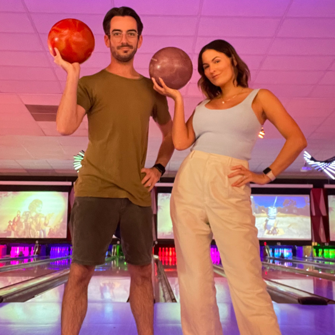 Two people bowling 