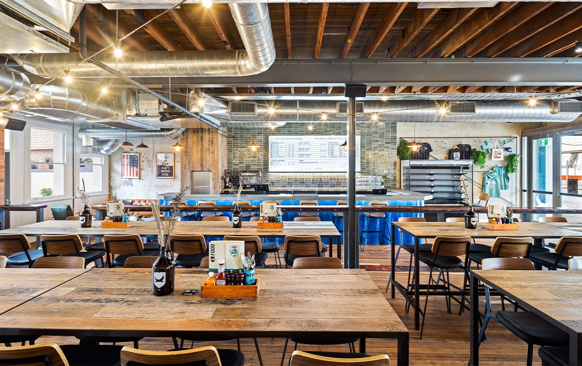 street level bar with a wall of taps at the bac