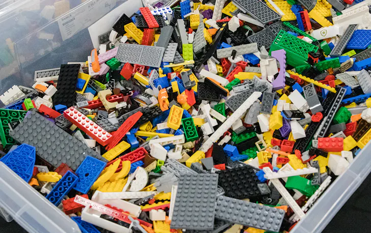 a plastic bucket full of bricks