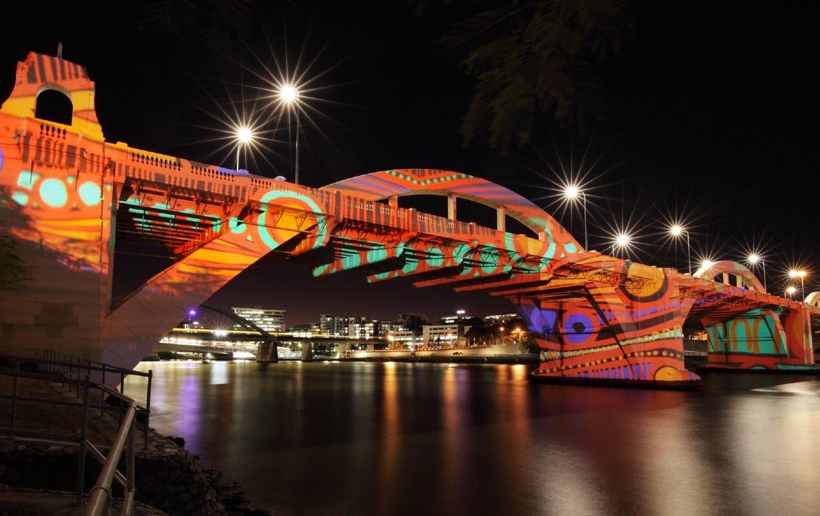 William Jolly Bridge lit up with artwork projected onto it 