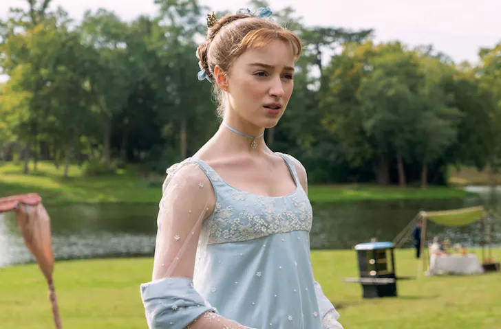 Daphne Bridgerton from the series Bridgerton in a blue Regency-era dress. 