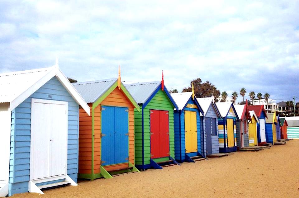 A collection of colourful beach boxes at Brighton Beach, a list-topper for some of the best things to do in Melbourne.