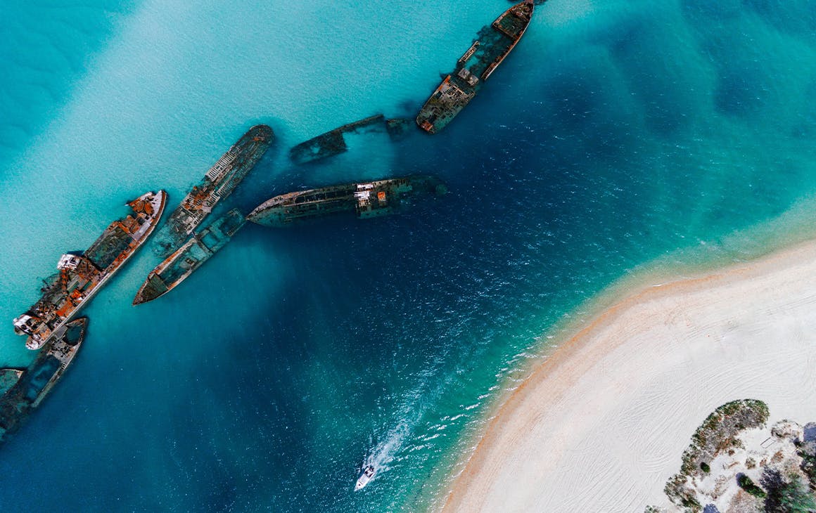shipwrecks in a blue ocean