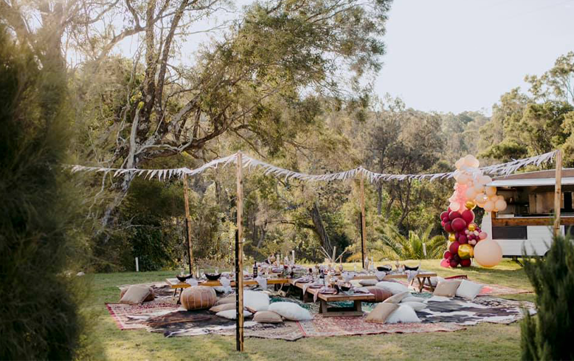 a picnic set up near a caravan bar at a a wedding venue near brisbane