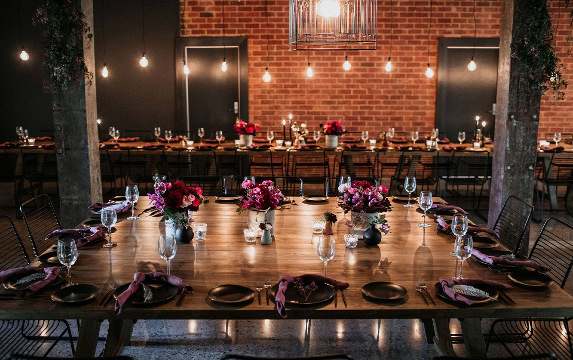 a wedding table in a warehouse-style space at The Lussh, a wedding venue in brisbane